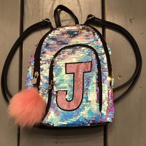 justice “J” Mini Sequin Backpack.